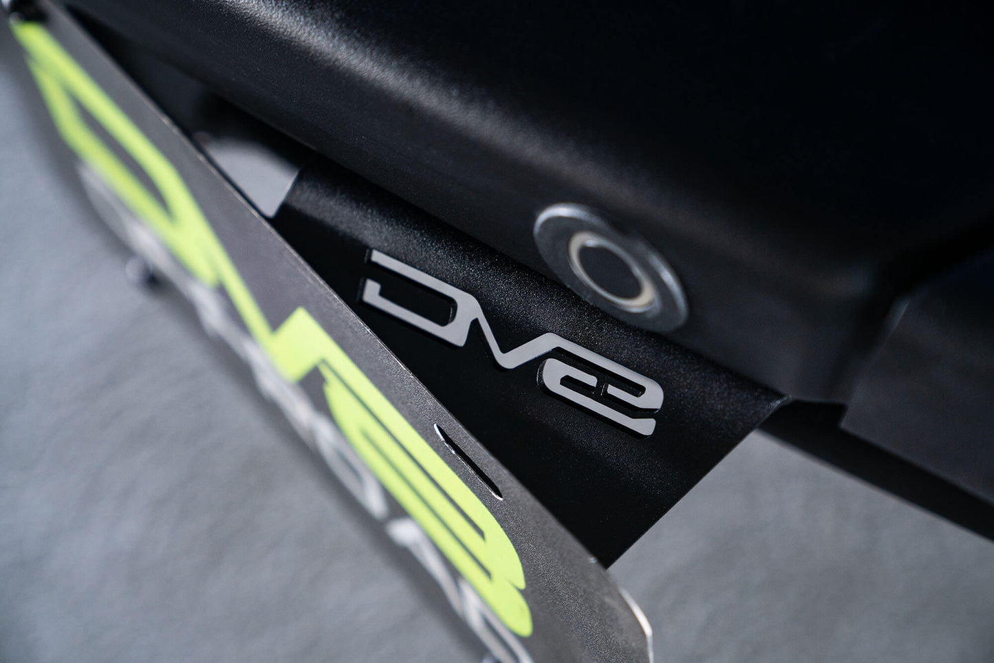 Front license plate relocation bracket places plate to the side of the bumper. by DV8 Offroad